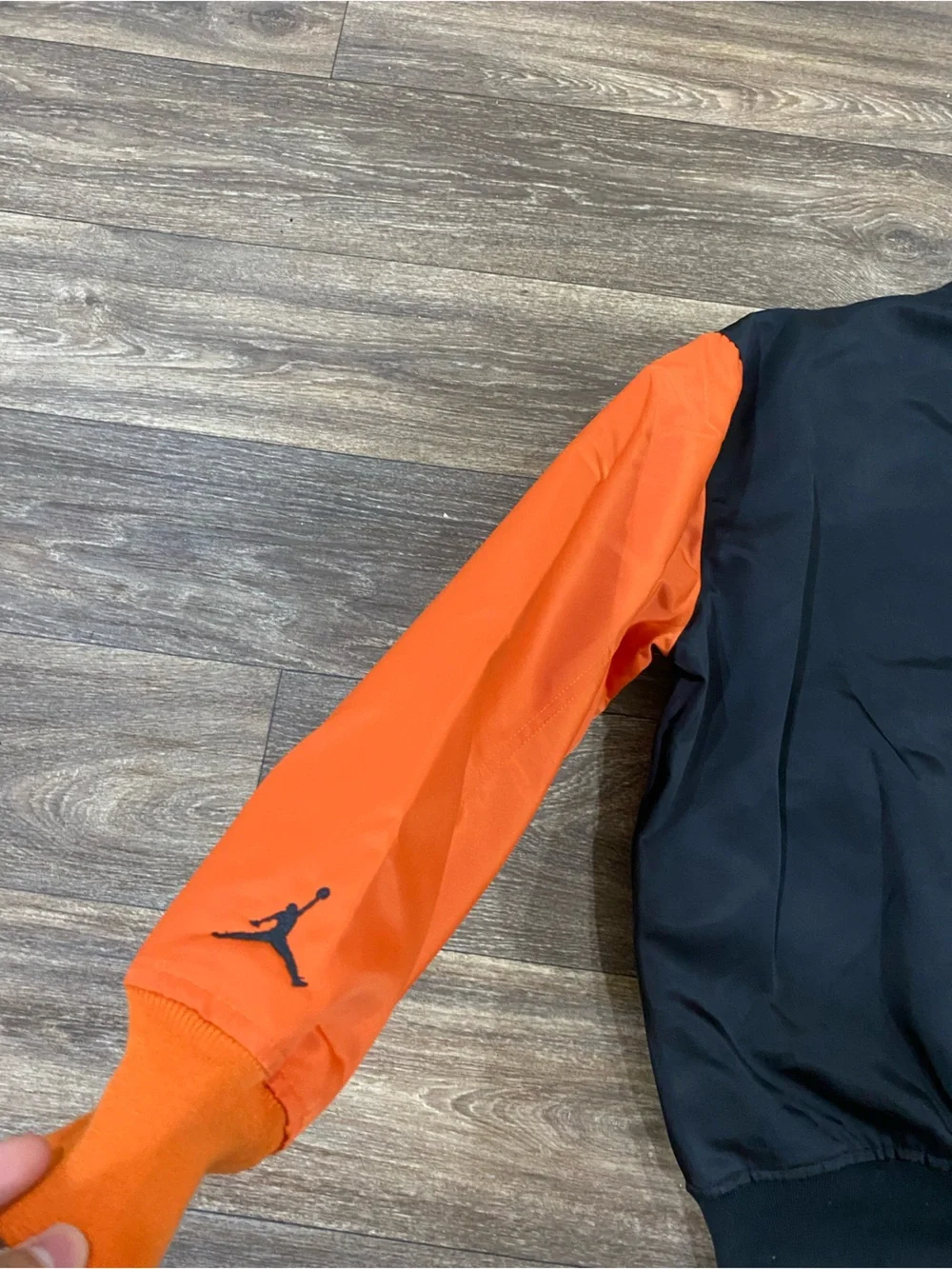 Jordan Black Jacket with White and Orange Lettering